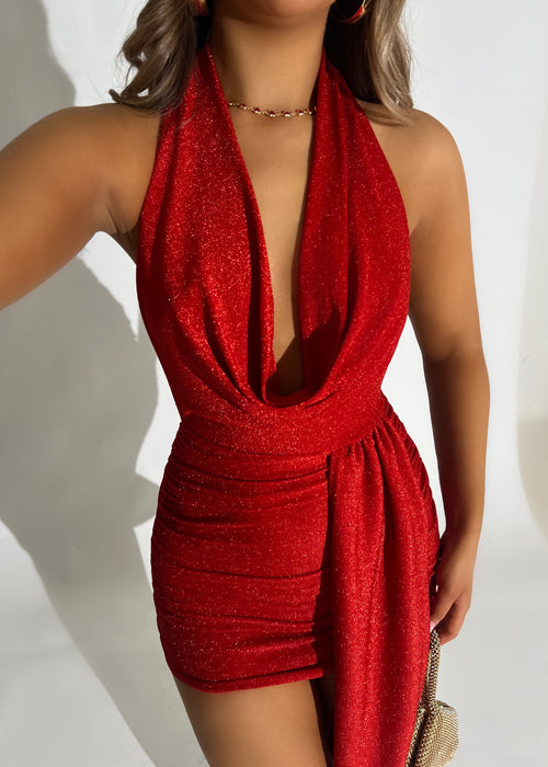 Women’s red lurex glitter mini dress with cowl neck design and drape detailing at the waist for a flattering fit. Halter neck style and a bodycon fit. 